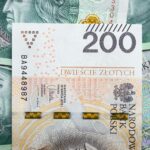 Detailed view of Polish 200 Zloty banknotes for financial and economic subjects.
